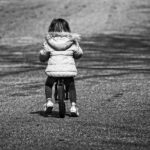 child on balance bike