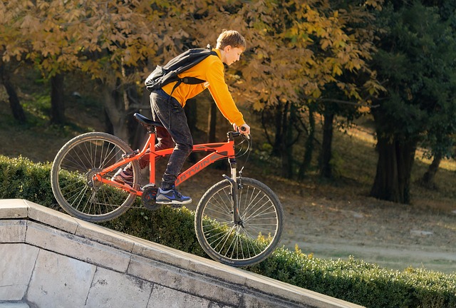 Child happily riding a pedal bike for the first time