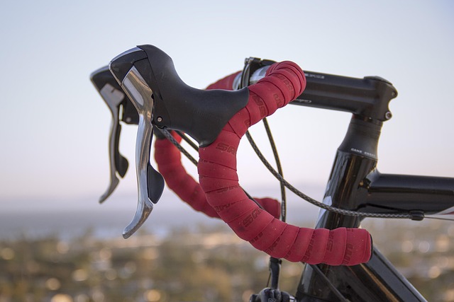 Close-up of a road bike saddle with intricate stitching and a cutout design, highlighting craftsmanship.