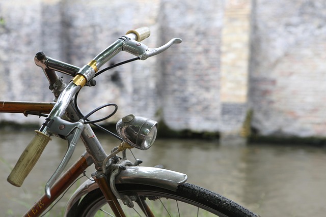 Vintage bicycle handlebars with a classic chrome front headlight